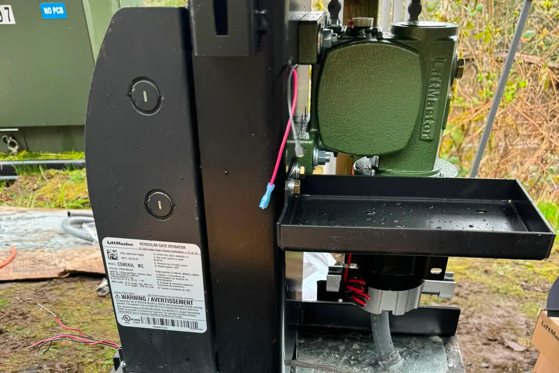 LiftMaster CSW24UL vehicular swing gate operator mounted on steel base