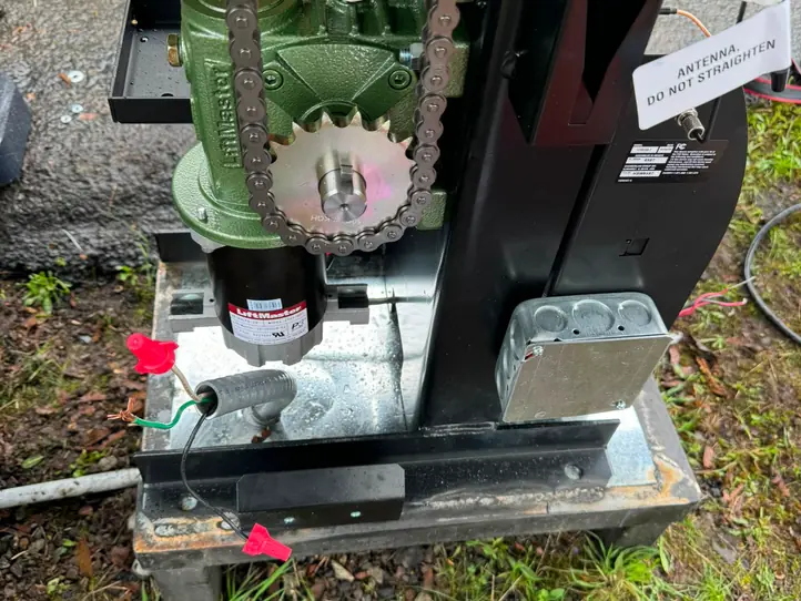 LiftMaster gearbox motor and chain sprocket drive of vehicular gate operator