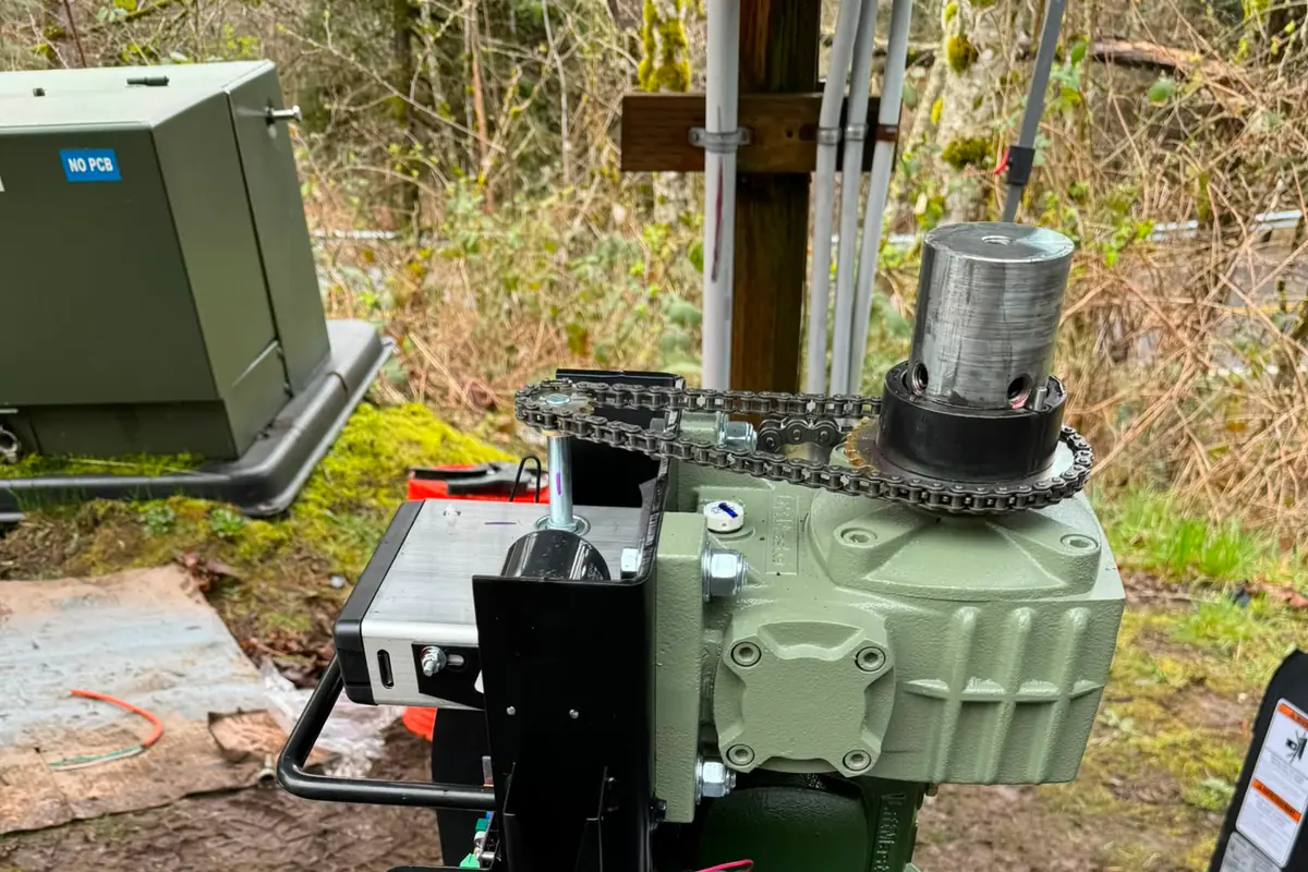 LiftMaster gate operator with backup batteries mounted at rural utility site