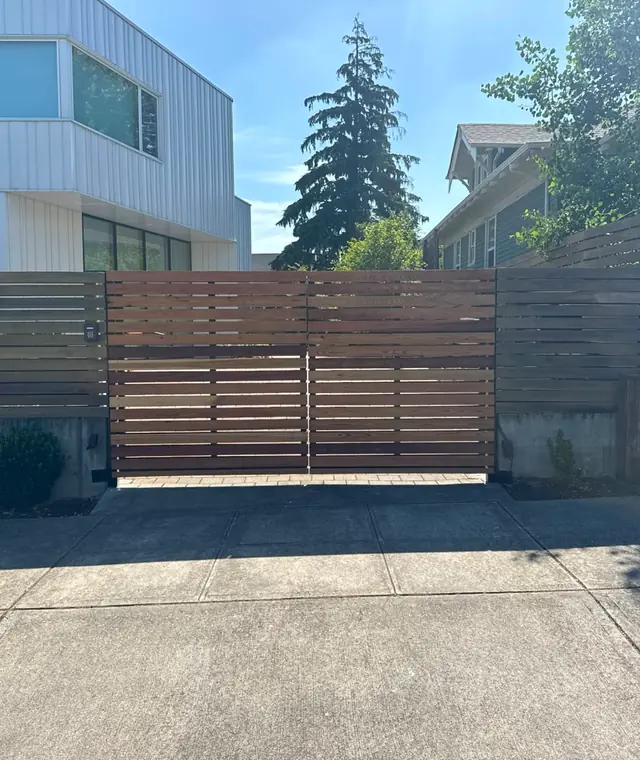 Modern horizontal cedar slat driveway gate with keypad, finished — Interstate Gate Repair